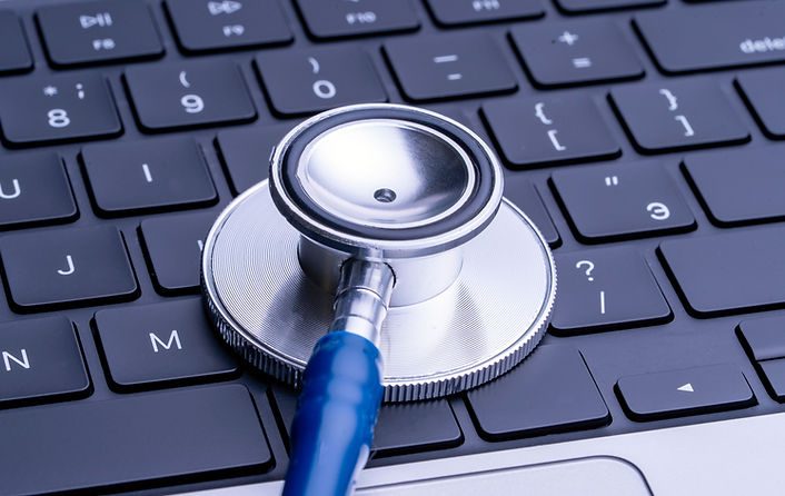 Laptop computer keyboard and stethoscope _ the intersection of healthcare and technology i