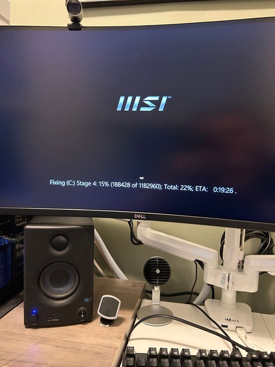 MSI logo on computer monitor displaying startup message Computer Repair Progress