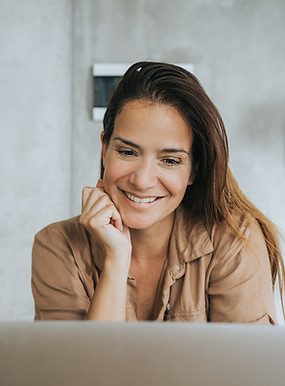 Woman Using Laptop  IT support that keeps up with you, wherever the next showing is.