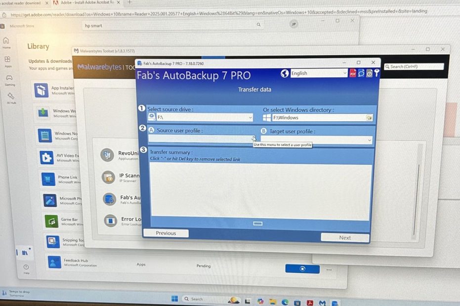 Fab's Autobackup 7 PRO interface on screen with Library options and data transfer.