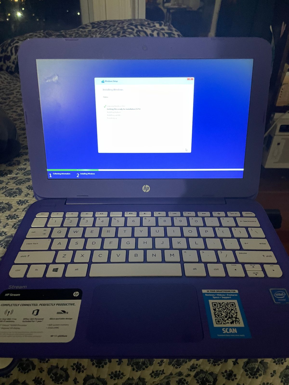 Purple HP laptop with white keyboard and open window display. Computer Repair Progress.